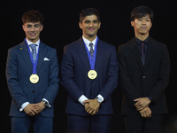 Ai Ogura (R) of Japan and Moto2 champion, Jorge Martin (C) of Spain and MotoGP Champion and David Alonso (L) of Colombia and Moto3 Champion...