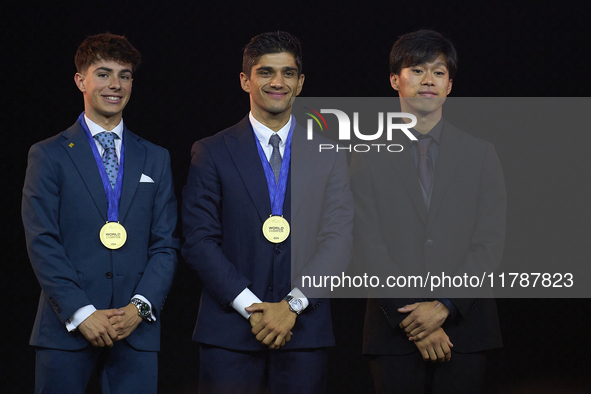 Ai Ogura (R) of Japan and Moto2 champion, Jorge Martin (C) of Spain and MotoGP Champion and David Alonso (L) of Colombia and Moto3 Champion...