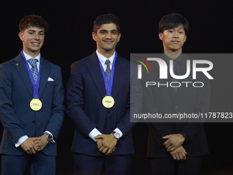 Ai Ogura (R) of Japan and Moto2 champion, Jorge Martin (C) of Spain and MotoGP Champion and David Alonso (L) of Colombia and Moto3 Champion...