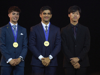 Ai Ogura (R) of Japan and Moto2 champion, Jorge Martin (C) of Spain and MotoGP Champion and David Alonso (L) of Colombia and Moto3 Champion...