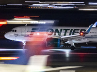 Frontier Airlines Airbus A320neo passenger aircraft spotted on accelerating on the runway for take off at Ronald Reagan Washington National...