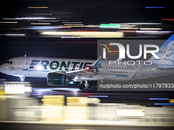 Frontier Airlines Airbus A320neo passenger aircraft spotted on accelerating on the runway for take off at Ronald Reagan Washington National...