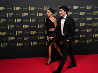 Marc Marquez (93) of Spain and Gresini Racing Moto GP Ducati with his girlfriend Gemma Pinto on the red carpet before the MotoGP Awards afte...