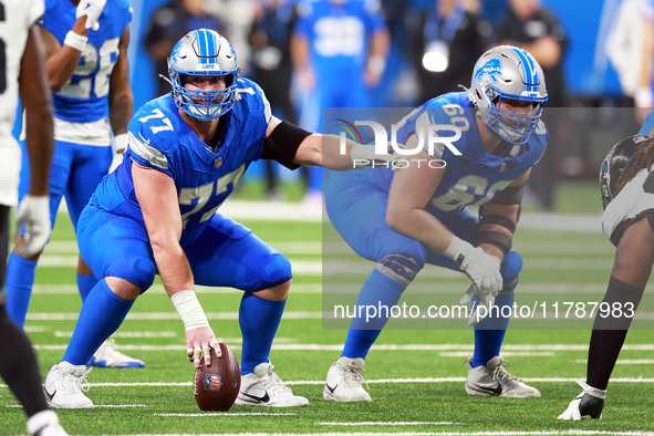 DETROIT,MICHIGAN-NOVEMBER17:  Center Frank Ragnow (77) of the Detroit Lions gestures before the snap during a game between the Detroit Lions...