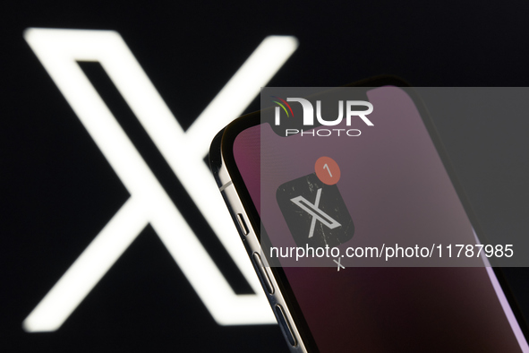 An editorial image features the X app icon, linked to Elon Musk, prominently displayed on an iPhone screen. The X logo is subtly visible in...