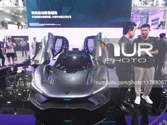 Visitors view the world's first AI-powered supercar, ROBO X, at the Guangzhou Auto Show in Guangzhou, China, on November 15, 2024. (