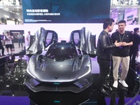 Visitors view the world's first AI-powered supercar, ROBO X, at the Guangzhou Auto Show in Guangzhou, China, on November 15, 2024. (