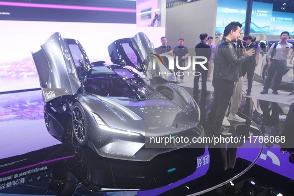 Visitors view the world's first AI-powered supercar, ROBO X, at the Guangzhou Auto Show in Guangzhou, China, on November 15, 2024. 