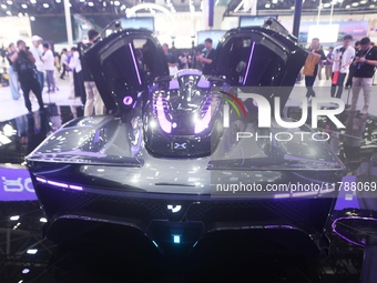 Visitors view the world's first AI-powered supercar, ROBO X, at the Guangzhou Auto Show in Guangzhou, China, on November 15, 2024. (