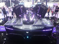 Visitors view the world's first AI-powered supercar, ROBO X, at the Guangzhou Auto Show in Guangzhou, China, on November 15, 2024. (