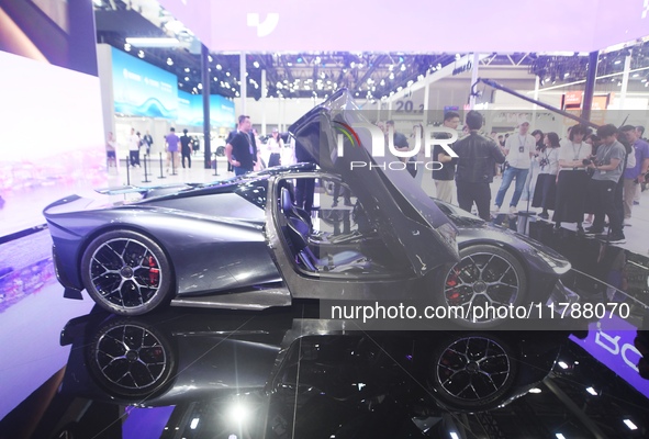 Visitors view the world's first AI-powered supercar, ROBO X, at the Guangzhou Auto Show in Guangzhou, China, on November 15, 2024. 