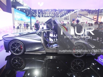 Visitors view the world's first AI-powered supercar, ROBO X, at the Guangzhou Auto Show in Guangzhou, China, on November 15, 2024. (