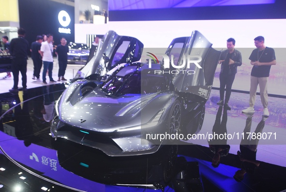 Visitors view the world's first AI-powered supercar, ROBO X, at the Guangzhou Auto Show in Guangzhou, China, on November 15, 2024. 