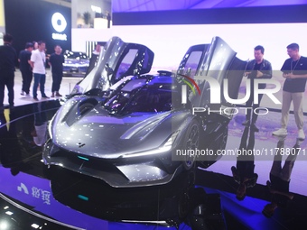 Visitors view the world's first AI-powered supercar, ROBO X, at the Guangzhou Auto Show in Guangzhou, China, on November 15, 2024. (