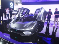 Visitors view the world's first AI-powered supercar, ROBO X, at the Guangzhou Auto Show in Guangzhou, China, on November 15, 2024. (