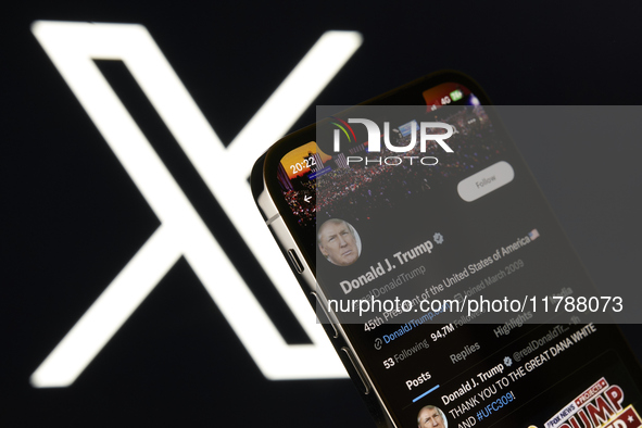 An editorial image shows an iPhone screen with Donald Trump’s personal account displayed on the X social network platform. The X logo appear...