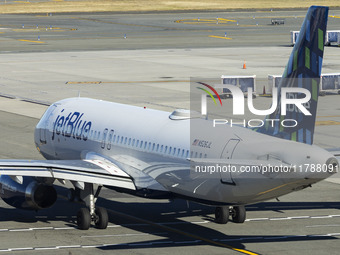 JetBlue Airbus A320-200 passenger aircraft spotted taxiing in LaGuardia airport LGA in New York City. The A320 airplane has the registration...