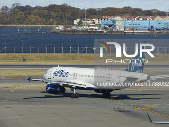 JetBlue Airbus A320-200 passenger aircraft spotted taxiing in LaGuardia airport LGA in New York City. The A320 airplane has the registration...