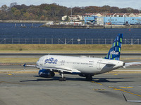 JetBlue Airbus A320-200 passenger aircraft spotted taxiing in LaGuardia airport LGA in New York City. The A320 airplane has the registration...