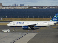 JetBlue Airbus A320-200 passenger aircraft spotted taxiing in LaGuardia airport LGA in New York City. The A320 airplane has the registration...