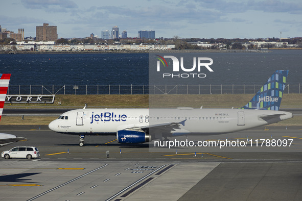 JetBlue Airbus A320-200 passenger aircraft spotted taxiing in LaGuardia airport LGA in New York City. The A320 airplane has the registration...