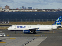 JetBlue Airbus A320-200 passenger aircraft spotted taxiing in LaGuardia airport LGA in New York City. The A320 airplane has the registration...