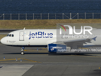 JetBlue Airbus A320-200 passenger aircraft spotted taxiing in LaGuardia airport LGA in New York City. The A320 airplane has the registration...