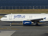 JetBlue Airbus A320-200 passenger aircraft spotted taxiing in LaGuardia airport LGA in New York City. The A320 airplane has the registration...