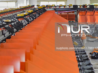 Workers sort parcels at an express logistics company in Qingzhou, China, on November 11, 2024. Monitoring data from the State Post Bureau sh...