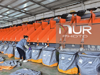 Workers sort parcels at an express logistics company in Qingzhou, China, on November 11, 2024. Monitoring data from the State Post Bureau sh...