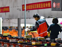 Workers sort parcels at an express logistics company in Qingzhou, China, on November 11, 2024. Monitoring data from the State Post Bureau sh...