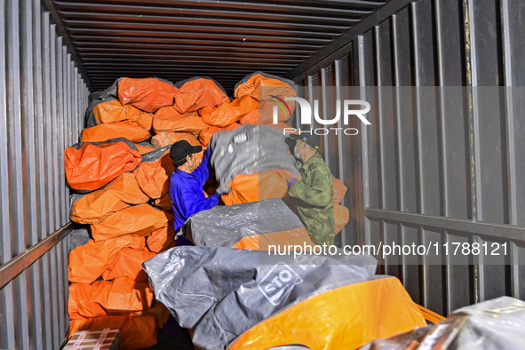 Workers sort parcels at an express logistics company in Qingzhou, China, on November 11, 2024. Monitoring data from the State Post Bureau sh...