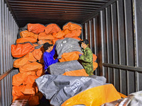 Workers sort parcels at an express logistics company in Qingzhou, China, on November 11, 2024. Monitoring data from the State Post Bureau sh...