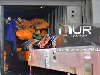 Workers sort parcels at an express logistics company in Qingzhou, China, on November 11, 2024. Monitoring data from the State Post Bureau sh...