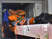 Workers sort parcels at an express logistics company in Qingzhou, China, on November 11, 2024. Monitoring data from the State Post Bureau sh...