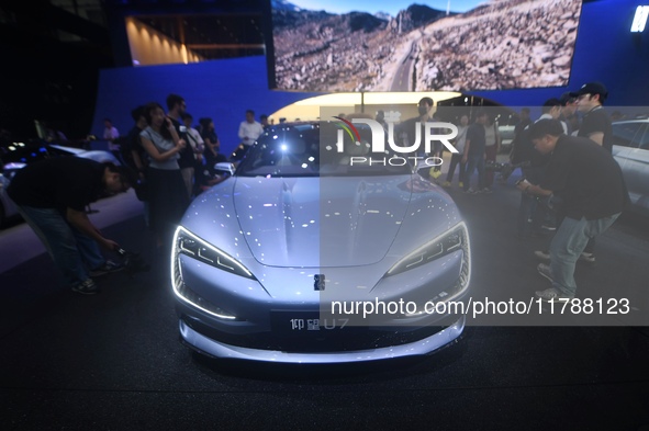 Visitors look at the newly released YANGWANG U7 luxury sedan at the Guangzhou Auto Show in Guangzhou, China, on November 15, 2024. 