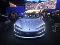 Visitors look at the newly released YANGWANG U7 luxury sedan at the Guangzhou Auto Show in Guangzhou, China, on November 15, 2024. (