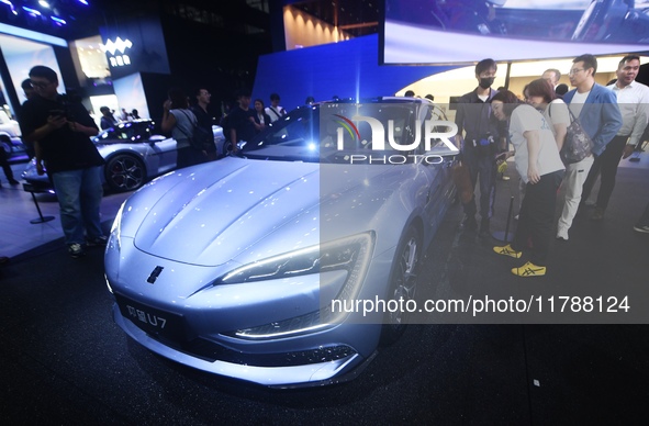 Visitors look at the newly released YANGWANG U7 luxury sedan at the Guangzhou Auto Show in Guangzhou, China, on November 15, 2024. 