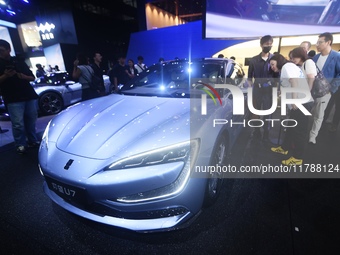 Visitors look at the newly released YANGWANG U7 luxury sedan at the Guangzhou Auto Show in Guangzhou, China, on November 15, 2024. (