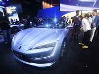 Visitors look at the newly released YANGWANG U7 luxury sedan at the Guangzhou Auto Show in Guangzhou, China, on November 15, 2024. (