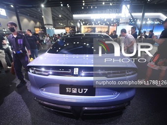 Visitors look at the newly released YANGWANG U7 luxury sedan at the Guangzhou Auto Show in Guangzhou, China, on November 15, 2024. (