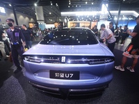 Visitors look at the newly released YANGWANG U7 luxury sedan at the Guangzhou Auto Show in Guangzhou, China, on November 15, 2024. (