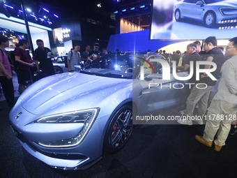 Visitors look at the newly released YANGWANG U7 luxury sedan at the Guangzhou Auto Show in Guangzhou, China, on November 15, 2024. (