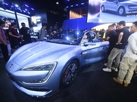 Visitors look at the newly released YANGWANG U7 luxury sedan at the Guangzhou Auto Show in Guangzhou, China, on November 15, 2024. (