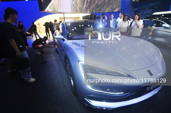 Visitors look at the newly released YANGWANG U7 luxury sedan at the Guangzhou Auto Show in Guangzhou, China, on November 15, 2024. 