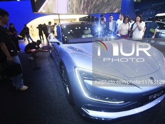 Visitors look at the newly released YANGWANG U7 luxury sedan at the Guangzhou Auto Show in Guangzhou, China, on November 15, 2024. (