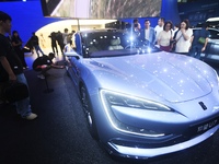 Visitors look at the newly released YANGWANG U7 luxury sedan at the Guangzhou Auto Show in Guangzhou, China, on November 15, 2024. (