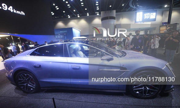 Visitors look at the newly released YANGWANG U7 luxury sedan at the Guangzhou Auto Show in Guangzhou, China, on November 15, 2024. 