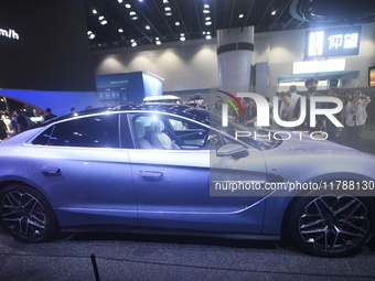 Visitors look at the newly released YANGWANG U7 luxury sedan at the Guangzhou Auto Show in Guangzhou, China, on November 15, 2024. (