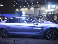 Visitors look at the newly released YANGWANG U7 luxury sedan at the Guangzhou Auto Show in Guangzhou, China, on November 15, 2024. (